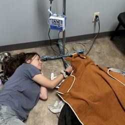 Animal Emergency Clinic - Nicole with Tia comforting her as she recovers from surgery