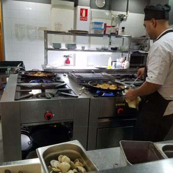 Gaudim - Open kitchen to watch the cooks do their Paella magic - Tapas Bars Near Me - Barcelona, B Gaudim - Open kitchen to watch the cooks do their Paella magic - Tapas Bars Near Me - Barcelona, B