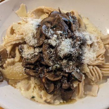 Cucina Basilico - Super Alfredo (cream, roasted garlic and shaved Parmesan) on sun-dried tomato pasta noodles with mushrooms added - Italian Near Me - San Diego, California Cucina Basilico - Super Alfredo (cream, roasted garlic and shaved Parmesan) on sun-dried tomato pasta noodles with mushrooms added - Italian Near Me - San Diego, California