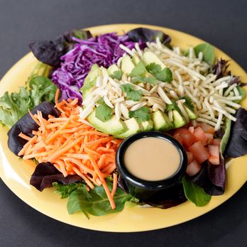 Cafe Yumm! - On Monroe - a plate of salad with dressing - Salad Near Me - Corvallis, Oregon Cafe Yumm! - On Monroe - a plate of salad with dressing - Salad Near Me - Corvallis, Oregon