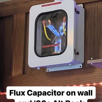 Flask - a tv mounted on the wall above a bar - Tacos Near Me - Mankato, Minnesota