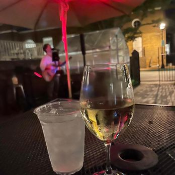 Reynolds Tavern - Glass of wine while listening to live music in the beer garden. - Tea Rooms Near Me - Annapolis, Maryland Reynolds Tavern - Glass of wine while listening to live music in the beer garden. - Tea Rooms Near Me - Annapolis, Maryland