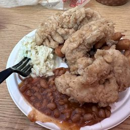 Chicken Tender Plate includes 3 huge tenders, BBQ, hush puppies, coleslaw and baked beans. BBQ was hidden under tenders. Chicken Tender Plate includes 3 huge tenders, BBQ, hush puppies, coleslaw and baked beans. BBQ was hidden under tenders.
