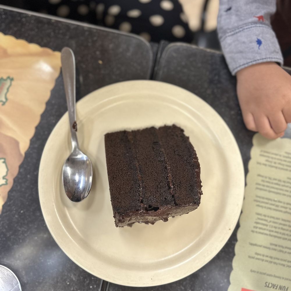 Village Pizza - a piece of chocolate cake on a plate - Pizza Near Me - Fort Mill, South Carolina Village Pizza - a piece of chocolate cake on a plate - Pizza Near Me - Fort Mill, South Carolina
