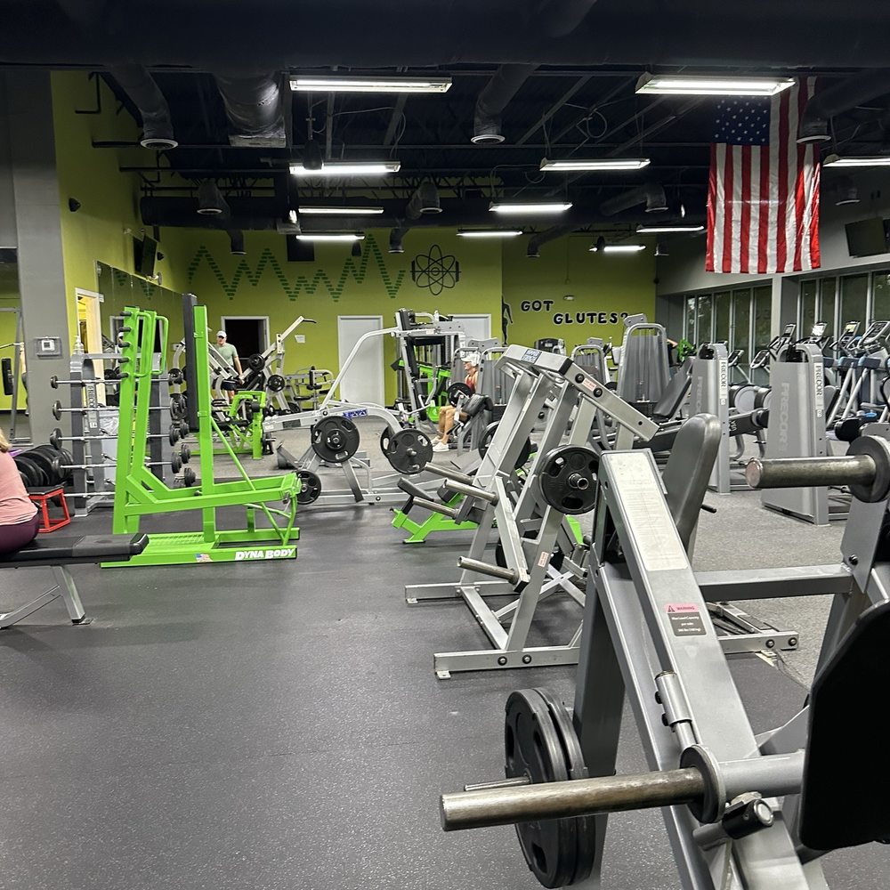 EnerGYM NorthJAX - Cardio area with Precor machines, American flag, large windows, and natural lighting. - Gyms Near Me - Jacksonville, Florida EnerGYM NorthJAX - Cardio area with Precor machines, American flag, large windows, and natural lighting. - Gyms Near Me - Jacksonville, Florida