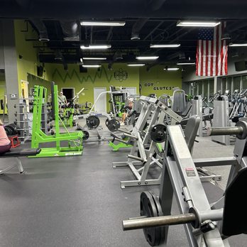 EnerGYM NorthJAX - Cardio area with Precor machines, American flag, large windows, and natural lighting. - Gyms Near Me - Jacksonville, Florida EnerGYM NorthJAX - Cardio area with Precor machines, American flag, large windows, and natural lighting. - Gyms Near Me - Jacksonville, Florida