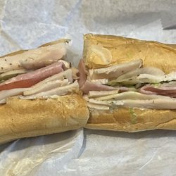 Mother Rucker's Subs - Turkey, Cooked Ham, Provolone, and hot and sweet peppers.