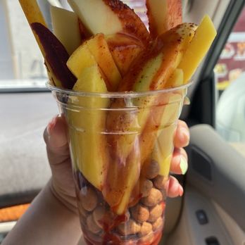 Taco Riendo - Mango  Japanese nuts  and a tamarind stick with chamoy and tajin - Mexican Near Me - Hays, Kansas