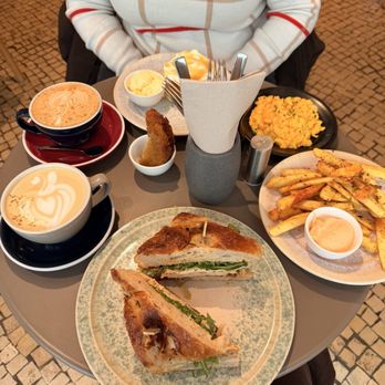 The Folks Chiado - Turkey breast focaccia sandwich, side of fries, side of eggs, pancakes w/ maple syrup/butter - Coffee & Tea Near Me - Lisbon, 11 The Folks Chiado - Turkey breast focaccia sandwich, side of fries, side of eggs, pancakes w/ maple syrup/butter - Coffee & Tea Near Me - Lisbon, 11