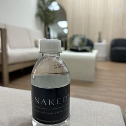 NAKEDMD - Carlsbad - Upon check in your are greeted and handed a cute little branded bottle of water.