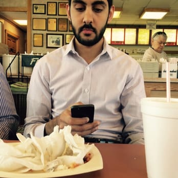 Lagondola Spaghetti House North - MJ texting his friends about his pizza burger - Italian Near Me - Decatur, Illinois