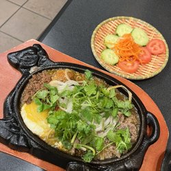 Gia Hoi Baguette - Bo Ne (Sizzling steak and eggs with pate, xiu mai [Vietnamese meatballs], onions, and cilantro) // ig: @sandyeatslocal