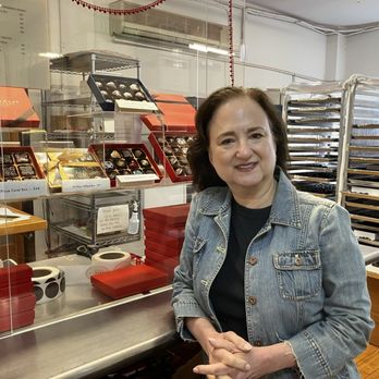 Chocolat Moderne - Joan in front of all her temptations - Chocolatiers & Shops Near Me - New York, New York
