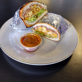 Tacos Y Mariscos El Guti - a plate with a burrito and sauce - Tacos Near Me - Arvada, Colorado Tacos Y Mariscos El Guti - a plate with a burrito and sauce - Tacos Near Me - Arvada, Colorado