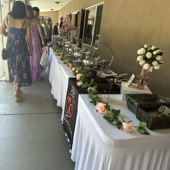 Tasty Creations Catering - Set up tables for service food - Caterers Near Me
