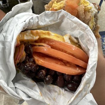 Laughing Gull - Half of breakfast burrito that was stacked with tomatoes and beans - Coffee & Tea Near Me - Manchester, Massachusetts