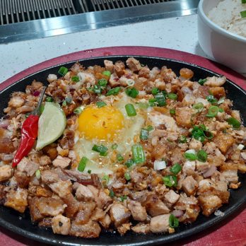 Tambayan - Sizzling pork belly sisig. - Filipino Near Me - Mesa, Arizona Tambayan - Sizzling pork belly sisig. - Filipino Near Me - Mesa, Arizona