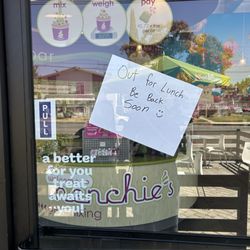Menchie's Frozen Yogurt - A handwritten sign that says be back soon out to lunch in the middle of the posted hours of operation.
