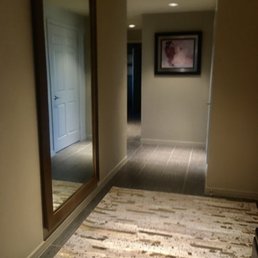 RH CAST RIBBED METAL FRAME LEANER MIRROR and RH TEEN DARCY METALLIC HIDE SUBWAY RUG