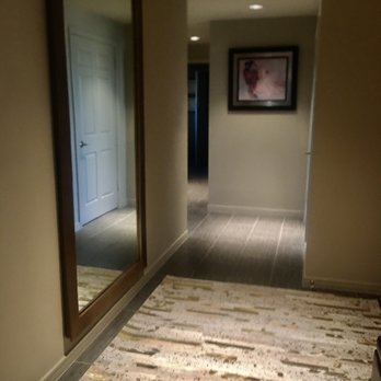 RH Scottsdale | The Gallery at Scottsdale Quarter - RH CAST RIBBED METAL FRAME LEANER MIRROR and RH TEEN DARCY METALLIC HIDE SUBWAY RUG - Furniture Stores Near Me - Scottsdale, Arizona