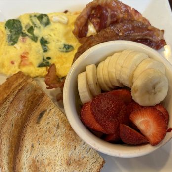Sibris Restaraunt - Feta, spinach, and tomato omelet with bacon, rye toast, and fresh fruit. - American Near Me - Bethlehem, Pennsylvania Sibris Restaraunt - Feta, spinach, and tomato omelet with bacon, rye toast, and fresh fruit. - American Near Me - Bethlehem, Pennsylvania