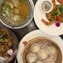 Top left to bottom right: Wonton Soup, Tiger Shrimp, Filet Mignon Pad See Ew, & Xiao Long Bao