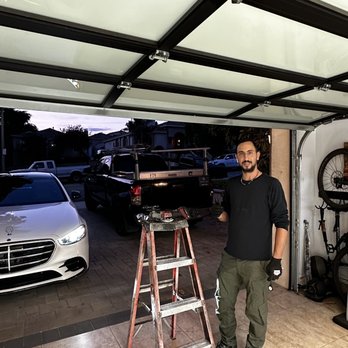 OB Gate & Fences - Oshri fixing my garage door - Garage Door Services Near Me