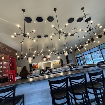 Corks & Hops - a bar with a lot of stools - Wine Bars Near Me - Anchorage, Alaska Corks & Hops - a bar with a lot of stools - Wine Bars Near Me - Anchorage, Alaska