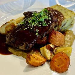 Suomenlinnan Panimo - Grilled reindeer calf roast with cep mushroom crème, red wine sauce, root vegetables and a rosemary, potato terrine.