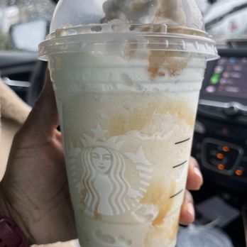 Starbucks - a hand holding a cup of iced coffee - Coffee & Tea Near Me - Cincinnati, Ohio