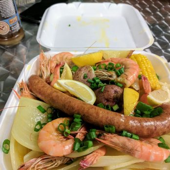 Mudbugs - At the Loop - Pile of shrimp, potatoes and sausage. - Seafood Markets Near Me - Mobile, Alabama Mudbugs - At the Loop - Pile of shrimp, potatoes and sausage. - Seafood Markets Near Me - Mobile, Alabama