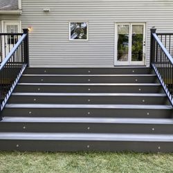 Nelson and Sons Builders - Two tone Trex deck with step lighting