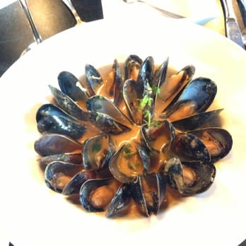 Elixir Restaurant - Mussels well presented! Prepped with a red curry coconut sauce. Bread soppin awesomeness. - New American Near Me - White River Junction, Vermont