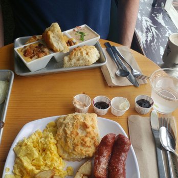 Biscuit Head - Gravy flight with a side of fried egg and brisket. Bottom, the full breakfast with andoullie sausage and potatoes. - Cafes Near Me - Asheville, North Carolina