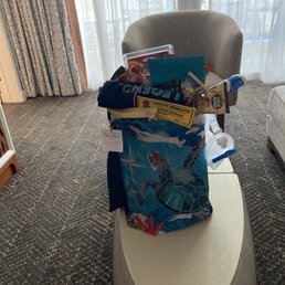 Snorkel set, hawaiian kid friendly snacks, fish finder,map, book, t shirt all in an adorable turtle backpack. Sooo cute!!!!!