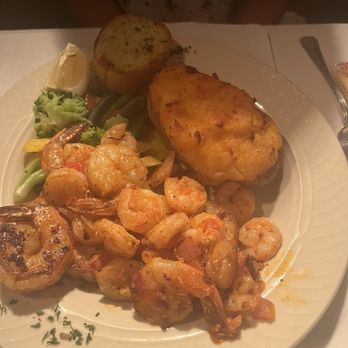 Magnolia Grill - Grilled shrimp... served on garlic bread with a twice baked potatoes and fresh vegetables - Italian Near Me - Fort Walton Beach, Florida Magnolia Grill - Grilled shrimp... served on garlic bread with a twice baked potatoes and fresh vegetables - Italian Near Me - Fort Walton Beach, Florida