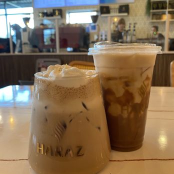 Haraz Coffee House - Banana latte (left), lotus cloud matcha turned into a latte (right) - Coffee & Tea Near Me - San Antonio, Texas Haraz Coffee House - Banana latte (left), lotus cloud matcha turned into a latte (right) - Coffee & Tea Near Me - San Antonio, Texas