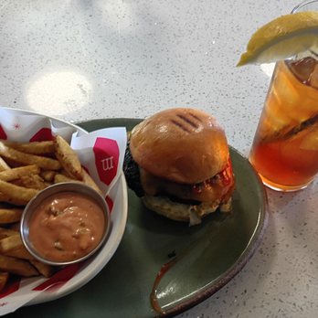 Moo Creamery - Signature Moo burger, golden fries, and refreshing sweet tea with a lemon wedge. - Burgers Near Me - Bakersfield, California Moo Creamery - Signature Moo burger, golden fries, and refreshing sweet tea with a lemon wedge. - Burgers Near Me - Bakersfield, California
