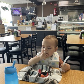 Caffe Connection - Zayn eating strawberries while waiting on his "little connections" meal, while eating strawberries. - Cafes Near Me - Spring Hill, Florida