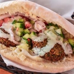 Falafel Mediterranean Cusine - Falafel - pita bread filled with hummus, falafel balls and tehine.
