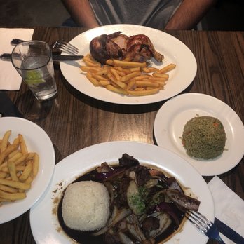 Pollos & Jarras - Lomo saltado with fries on the side . Rotisserie chicken with green rice. - Peruvian Near Me - Miami, Florida