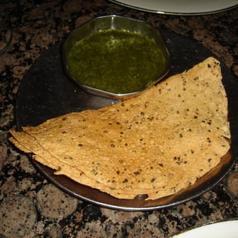 Cafe Bombay - Complimentary spicy papadums w/cilantro chutney - Indian Near Me - Norcross, Georgia Cafe Bombay - Complimentary spicy papadums w/cilantro chutney - Indian Near Me - Norcross, Georgia