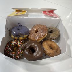Lavon Donuts & Pizza - Blueberry frosting donut, pumpkin spice, blueberry glaze donut, red velvet, double chocolate, chocolate with sprinkles, and a glazed cronut
