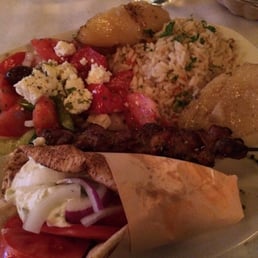 Chicken in pita dressed, pork skewer Greek salad, lemon potatoes and rice! Yumm! :) Chicken in pita dressed, pork skewer Greek salad, lemon potatoes and rice! Yumm! :)