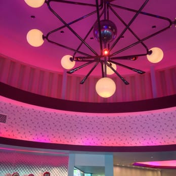 Flo's V8 Cafe - The chandelier in Flo's diner foyer lights up the same colors and sequence as the Disney glow sticks.  Pretty neat. - Cafes Near Me - Anaheim, California