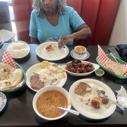 Indo Pak Restaurant N Grill - Top-left, to bottom-right: Rice, Hot chai tea Naan bread, seekh chicken, chicken 65, naan bread Hot green tea, Daal Maash (lentil soup)