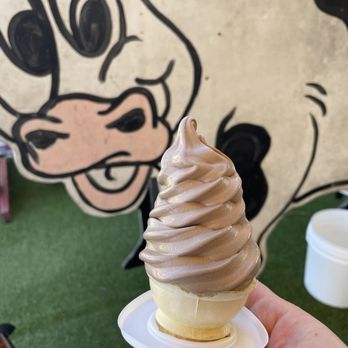 Moo's Soft Serve - a hand holding an ice cream cone - Ice Cream & Frozen Yogurt Near Me - Indialantic, Florida Moo's Soft Serve - a hand holding an ice cream cone - Ice Cream & Frozen Yogurt Near Me - Indialantic, Florida