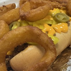 Momma Moodys Grinders - Dog On Grinder and two orders of onion rings.  There's a 1/4 lb all beef hot dog under all that grinder meat, nacho cheese, and peppers!