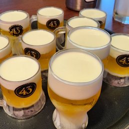 a tray of beer glasses a tray of beer glasses