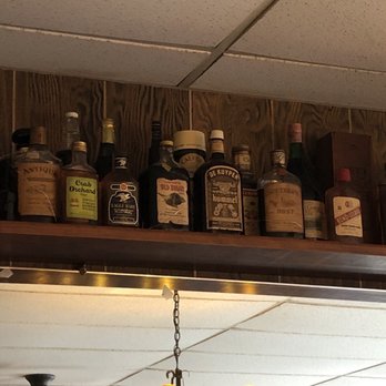 Wagner's Village Inn - a shelf of liquor bottles - American Near Me - Oldenburg, Indiana Wagner's Village Inn - a shelf of liquor bottles - American Near Me - Oldenburg, Indiana